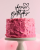 Topper urodzinowy na tort - Fikuśny napis Happy Birthday z serduszkiem.png